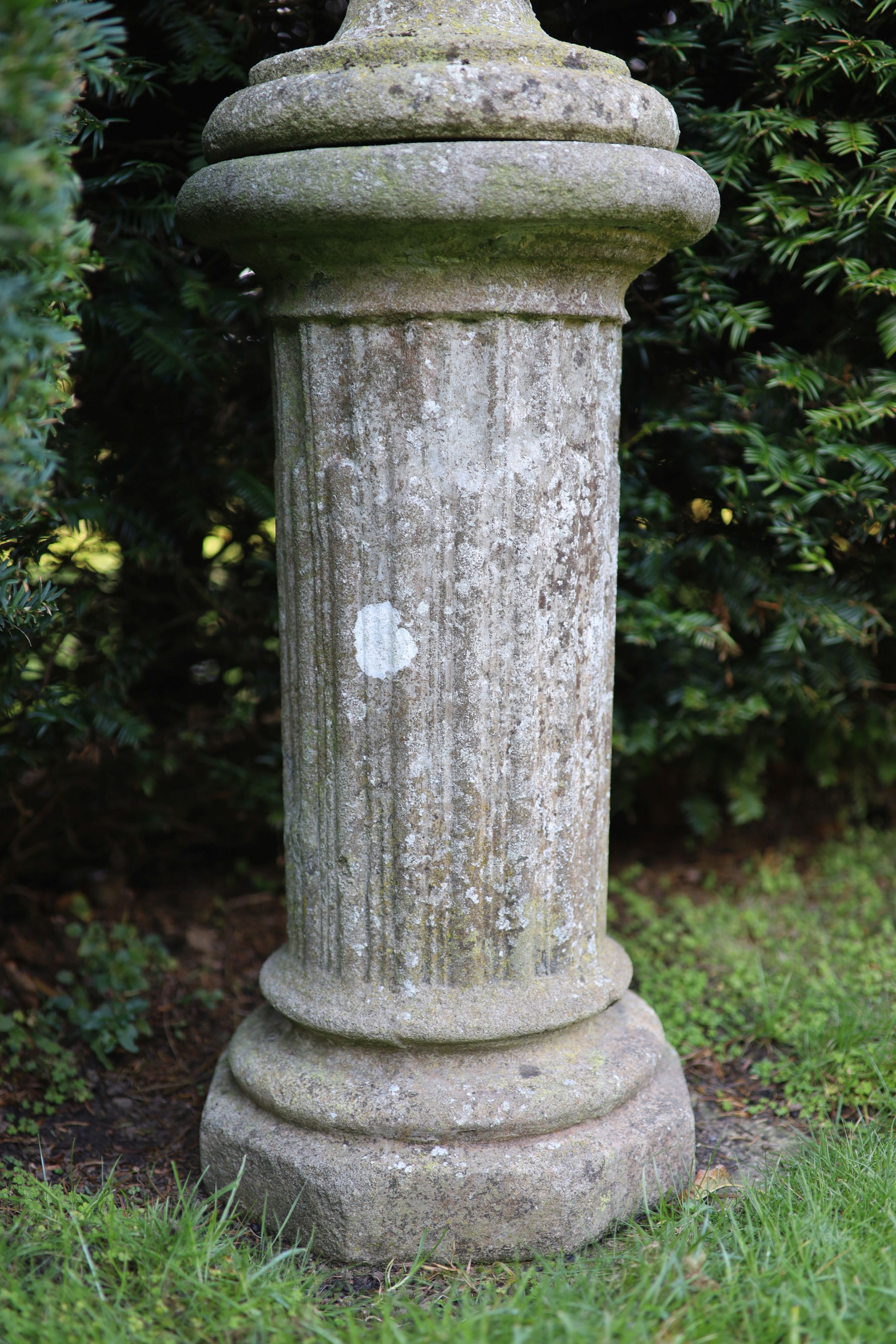 A reconstituted stone garden urn on fluted pedestal, height 112cm diameter 40cm